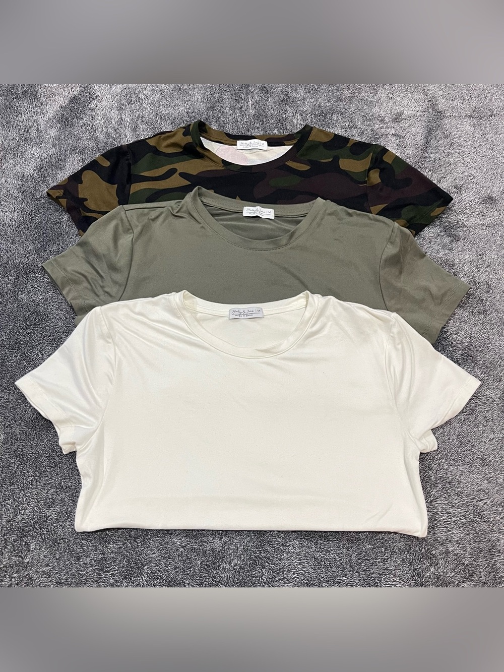 Three T-shirts: Camo, Olive Green, and cream for women size M